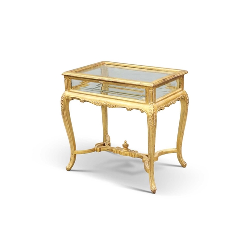 767 - A LOUIS XV STYLE GILTWOOD BIJOUTERIE TABLE, 20TH CENTURY the rectangular case with a bevelled mirror... 