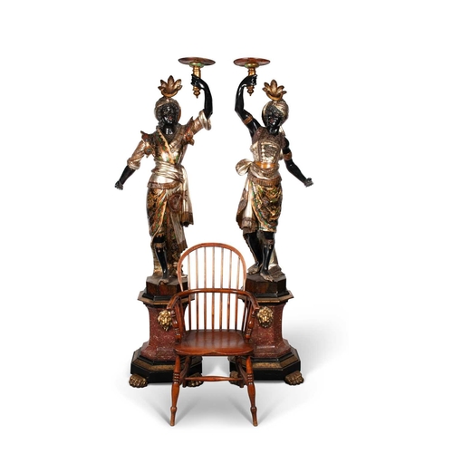 771 - A PAIR OF NORTH ITALIAN EBONISED, GILT AND POLYCHROME-DECORATED BLACKAMOOR TORCHÈRES probably Venice... 