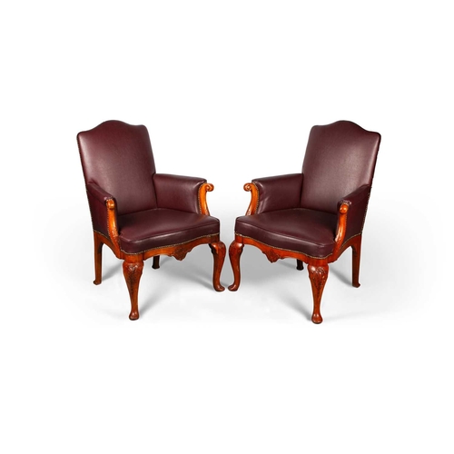 786 - A PAIR OF LATE 19TH CENTURY STAINED AND CARVED BEECH UPHOLSTERED LIBRARY CHAIRS each with scrolling ... 