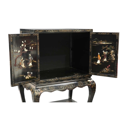 792 - A CHINESE LAQUER CABINET the cabinet with a pair of panel doors decorated front and back with figure... 