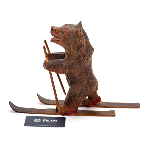 799 - A BLACK FOREST NOVELTY CARVING OF A SKIING BEAR, CIRCA 1900 18.5cm high