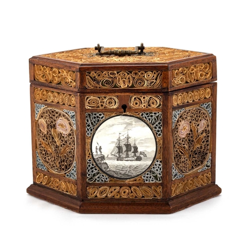 815 - A GEORGE III ROLLED PAPER SIX-SIDED TEA CADDY the hinged cover with a brass swing handle, opening to... 