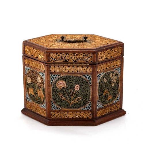 815 - A GEORGE III ROLLED PAPER SIX-SIDED TEA CADDY the hinged cover with a brass swing handle, opening to... 