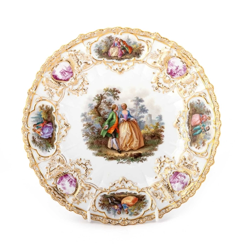 92 - A MEISSEN PLATE hand-painted with a courting couple, the rim painted with puce and polychrome vignet... 