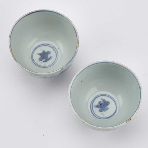 118 - A PAIR OF CHINESE PORCELAIN BLUE AND WHITE 'LION-DOG' WINE CUPS, JIAJING/ WANLI PERIOD thinly potted... 