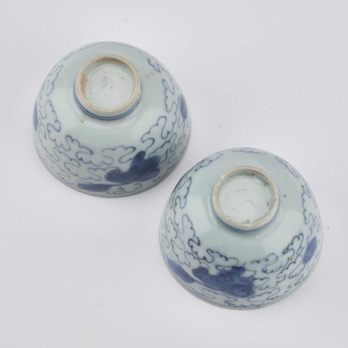 118 - A PAIR OF CHINESE PORCELAIN BLUE AND WHITE 'LION-DOG' WINE CUPS, JIAJING/ WANLI PERIOD thinly potted... 