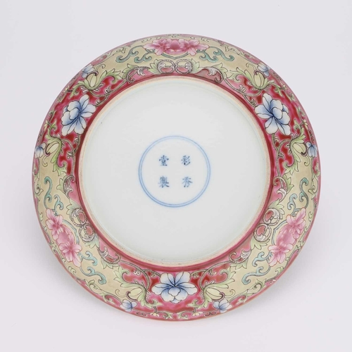 129 - A CHINESE FAMILLE ROSE RUBY-BACK DISH circular, painted with bats to the centre within a painted ruy... 