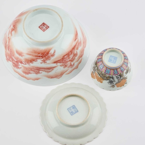 131 - THREE PIECES OF CHINESE PORCELAIN comprising an iron-red 'landscape' bowl, floral cup and saucer dis... 