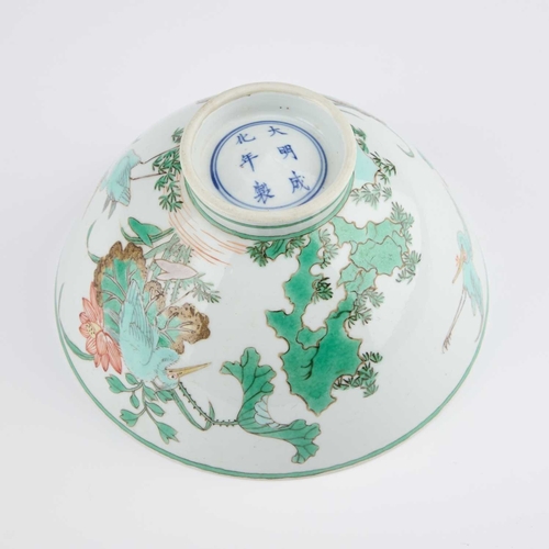 163 - A CHINESE FAMILLE VERTE BOWL the rounded sides painted with cranes, rockwork and foliage, bears unde... 