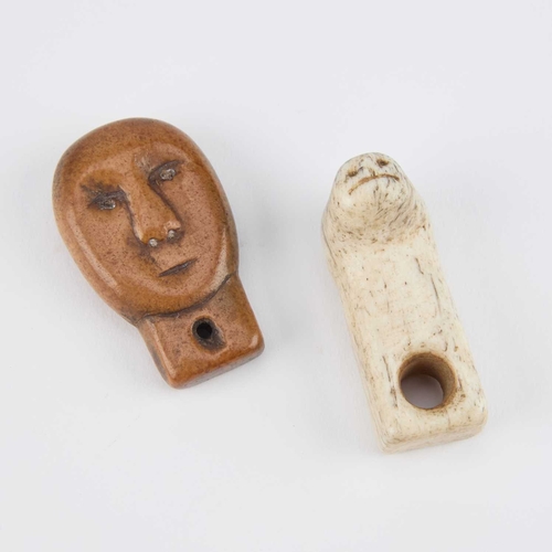 3 - TWO ANTIQUE INUIT CARVINGS the first carved bone, the second carved from a stone as a face. (2) Firs... 