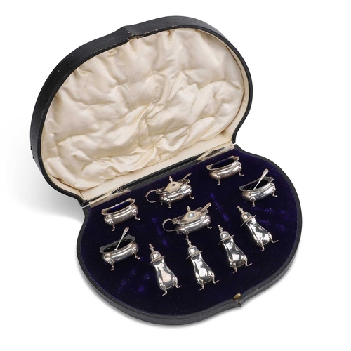 432 - A GEORGE V SILVER CRUET SET by Edward Souter Barnsley, Birmingham 1912, comprising four salts, a pai... 