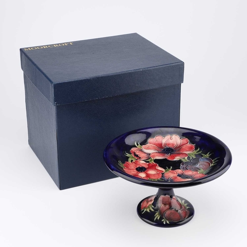 68 - A MOORCROFT POTTERY 'ANEMONE' COMPORT painted initials and paper label, with a Moorcroft box. 12cm h... 