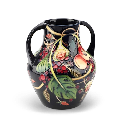 69 - A LARGE MOORCROFT POTTERY 'QUEEN'S CHOICE' TWO-HANDLED VASE BY EMMA BOSSONS painted and impressed ma... 