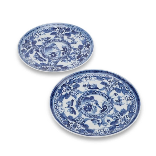 84 - A PAIR OF CHINESE BLUE AND WHITE PLATES each centrally painted with a bird perched on a branch, with... 