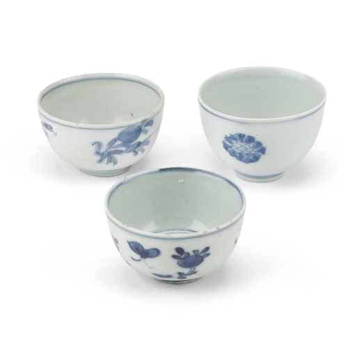 94 - THREE CHINESE PORCELAIN BLUE AND WHITE WINE CUPS, WANLI PERIOD thinly potted round-sided form with a... 