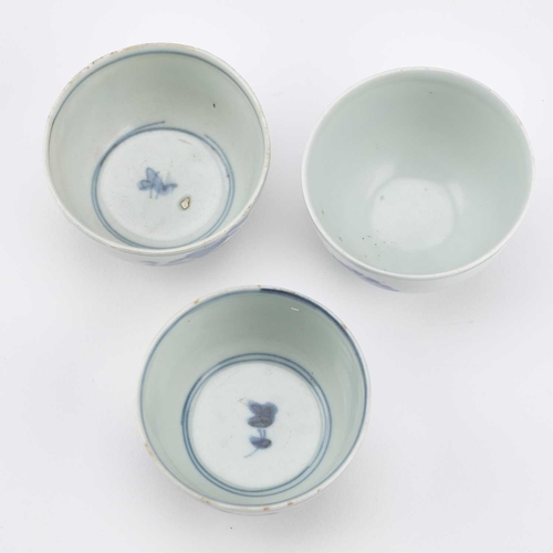 94 - THREE CHINESE PORCELAIN BLUE AND WHITE WINE CUPS, WANLI PERIOD thinly potted round-sided form with a... 