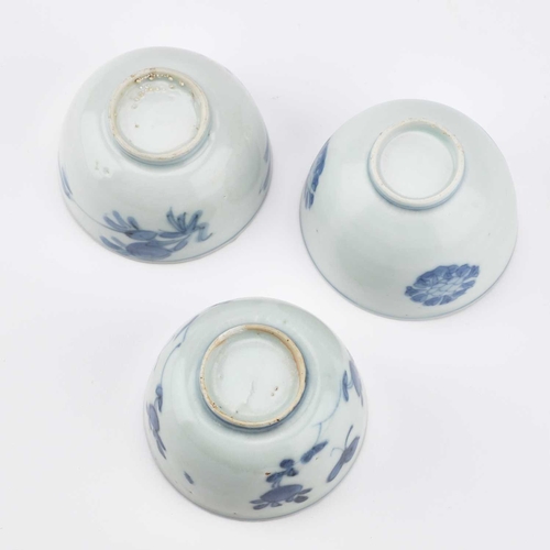 94 - THREE CHINESE PORCELAIN BLUE AND WHITE WINE CUPS, WANLI PERIOD thinly potted round-sided form with a... 