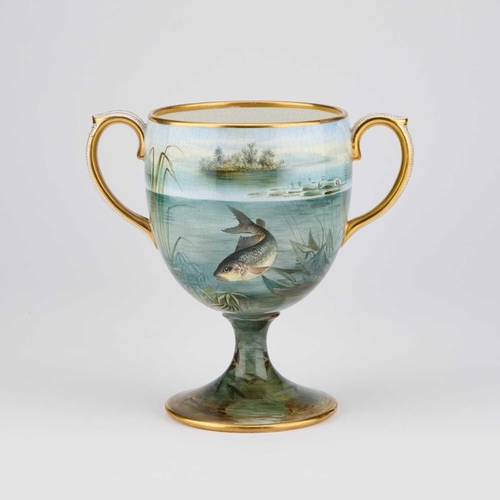 103 - A 19TH CENTURY PAINTED POTTERY TWO-HANDLED CUP the ovoid bowl painted with fish, the rims and handle... 