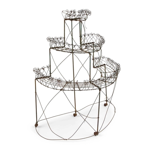 1045 - A 19TH CENTURY COUNTRY HOUSE WIREWORK PLANT STAND of three graduating demilune tiers. 125cm high, 97... 