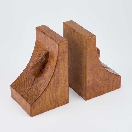 1186 - ROBERT THOMPSON OF KILBURN: A PAIR OF MOUSEMAN OAK BOOKENDS of typical convex form, each with a carv... 