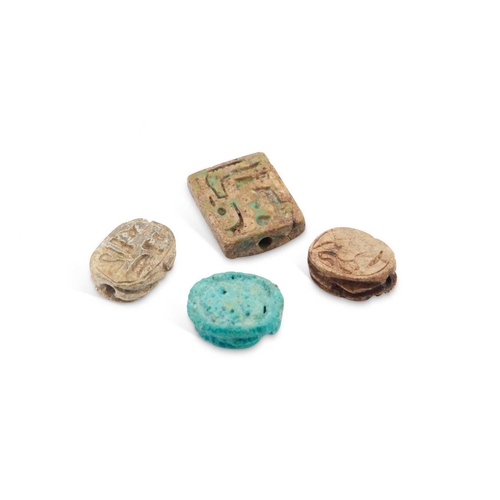 12 - THREE ANCIENT EGYPTIAN SCARAB AMULETS, LATE PERIOD (664-332 B.C.) together with an Steatite plaque w... 