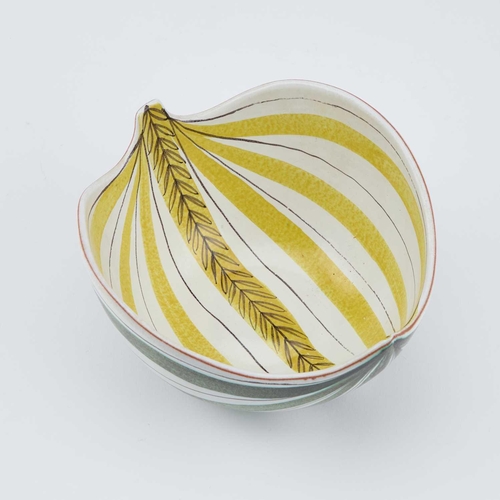 121 - STIG LINDBERG FOR GUSTAVSBERG, A SWEDISH FAIENCE LEAF BOWL, CIRCA 1950S decorated with yellow stripe... 