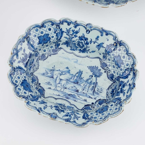 132 - A PAIR OF DUTCH DELFT BLUE AND WHITE DISHES, CIRCA 1760 Johannes van Duyn, each with moulded scroll ... 