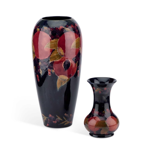 138 - TWO WILLIAM MOORCROFT 'POMEGRANATE' PATTERN VASES the large vase of ovoid form, the smaller vase wit... 
