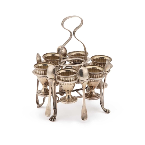 147 - AN EARLY 20TH CENTURY SILVER-PLATED EGG CRUET the frame holding six egg cups and five spoons. 20cm h... 