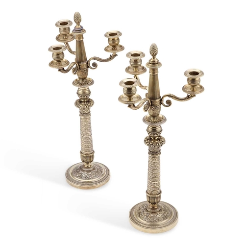 148 - A PAIR OF LATE 19TH CENTURY FRENCH PLATED SILVER-GILT CANDELABRA each three-branch superstructure wi... 
