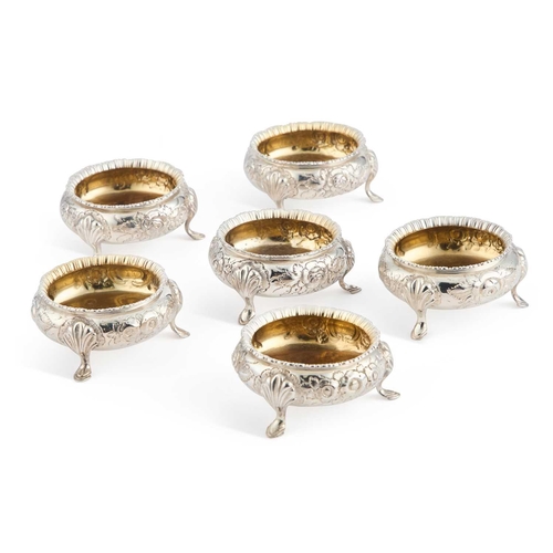 161 - A SET OF SIX LATE VICTORIAN SILVER-PLATED SALTS by Martin, Hall & Co, each chased with flowers a... 