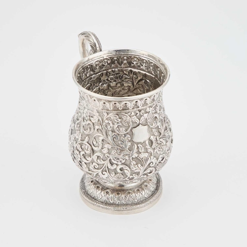 189 - A LATE 19TH CENTURY ANGLO-INDIAN SILVER MUG unmarked, Cutch, c.1890, of baluster form, the S-scroll ... 