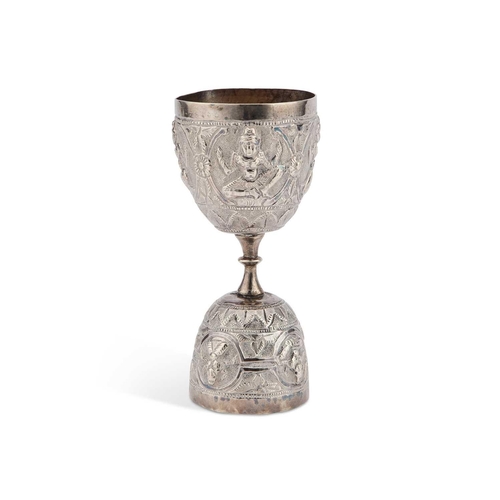 193 - AN INDIAN SILVER DOUBLE-ENDED CUP 19th Century, chased with deities. 10.5m high, 2.4 troy ouncesThe ... 