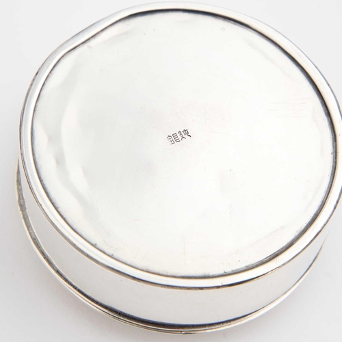 205 - A JAPANESE SILVER RING BOX signed to the underside, circular, the hinged cover decorated with applie... 