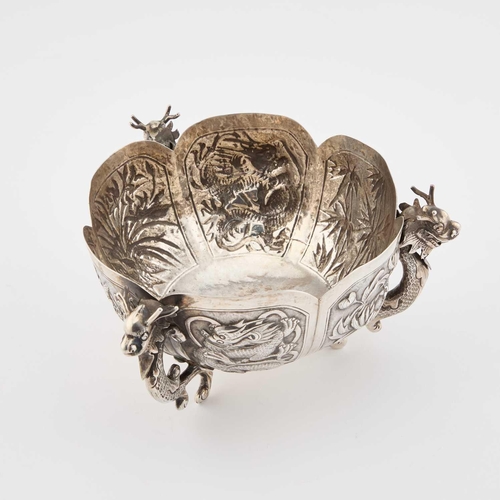 225 - A CHINESE SILVER TRIPOD BOWL by Zhuo, Canton, retailed by Kam Lung, Hong Kong, c.1900, the lobed cir... 