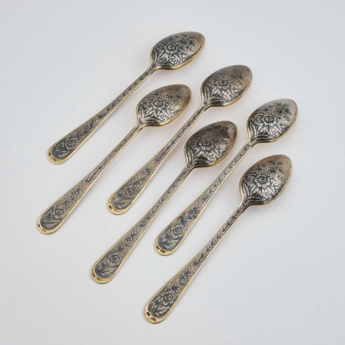 240 - A SET OF SIX RUSSIAN SILVER-GILT AND NIELLO TEASPOONS Soviet era, the reverses decorated with flower... 