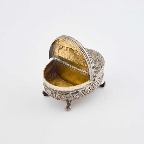 260 - A SMALL CONTINENTAL SILVER BOX 18th/ 19th Century, oval with double hinged covers, raised on scroll ... 