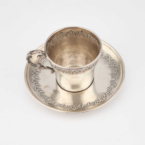 261 - AN EARLY 20TH CENTURY FRENCH SILVER CUP AND SAUCER by Charles Hack, Paris, each chased with a border... 