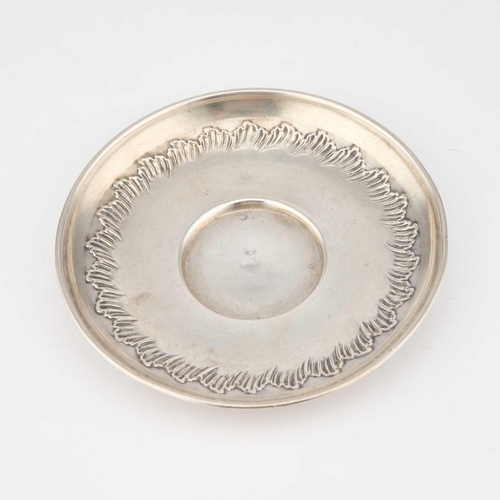 261 - AN EARLY 20TH CENTURY FRENCH SILVER CUP AND SAUCER by Charles Hack, Paris, each chased with a border... 