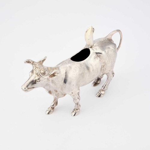 264 - A LATE 19TH CENTURY GERMAN SILVER COW CREAMER by Berthold Muller, Chester 1898, modelled standing, e... 