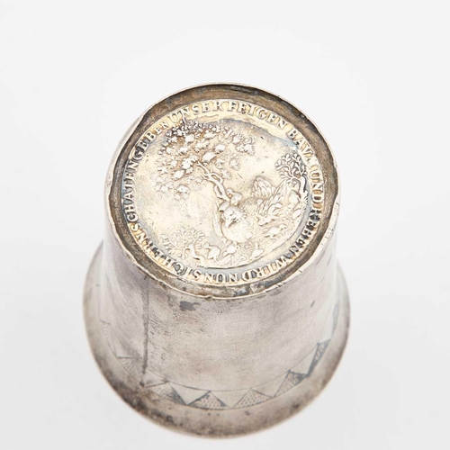 269 - A CONTINENTAL SILVER BEAKER WITH COIN-INSET BASE indistinct marks, engraved with a zig-zag border be... 