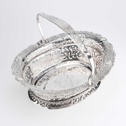 287 - A GEORGE II IRISH SILVER BREAD BASKET by John Hamilton, Dublin, c.1730, oval with fixed crested hand... 