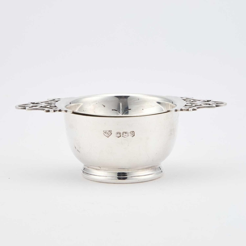 293 - AN ELIZABETH II SILVER TEA STRAINER ON STAND by J N Lowe (Sheffield) Ltd, Sheffield 1969. (2) Strain... 