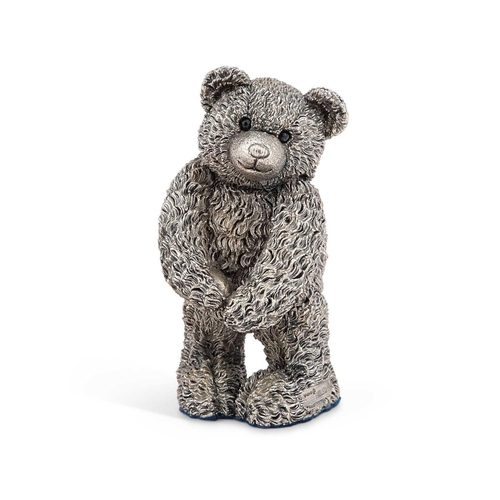 303 - AN ELIZABETH II SILVER MODEL OF A TEDDY BEAR by Country Artists, Birmingham 2000, modelled as a stan... 