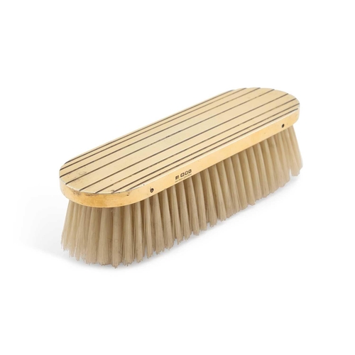 323 - A GEORGE VI SILVER-GILT CLOTHES BRUSH by Cartier Ltd, London 1948, rectangular with rounded ends, de... 