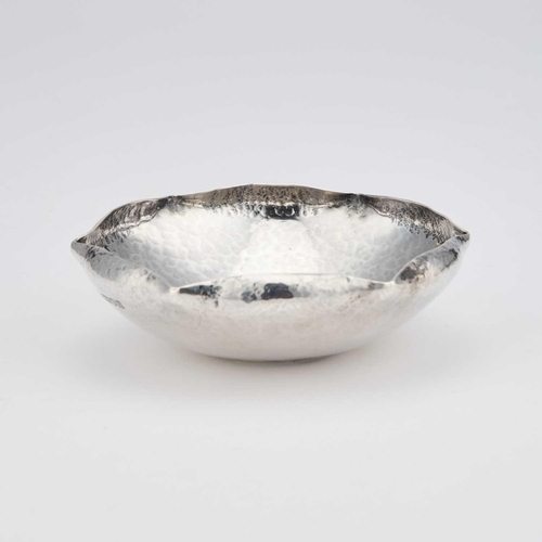 340 - RAMSDEN & CARR: AN ARTS AND CRAFTS SILVER 'COIN' DISH by Omar Ramsden & Alwyn Carr, London 1911,... 