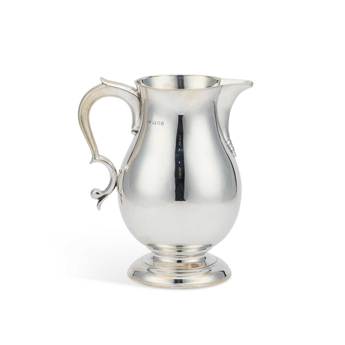 345 - A LARGE GEORGE I STYLE SILVER BEER JUG by Lionel Alfred Crichton, London 1935, of baluster form with... 