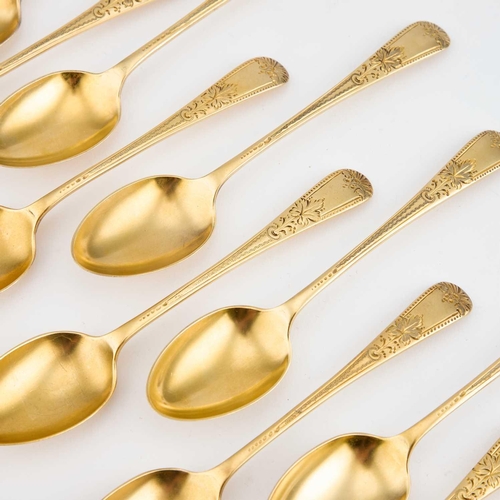 360 - A SET OF NINE EDWARDIAN SILVER-GILT TEASPOONS by Thomas Levesley, Sheffield 1901, each engraved with... 