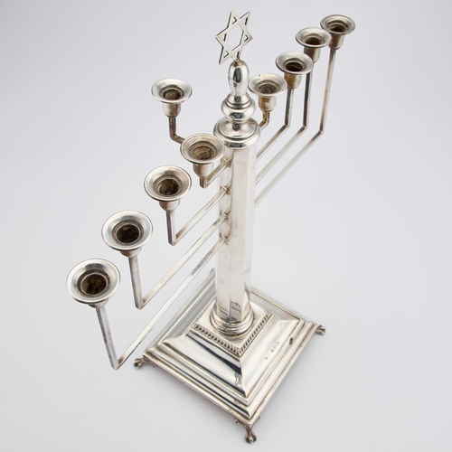 373 - JUDAICA: A GEORGE V SILVER MUSICAL CHANUKAH LAMP by Britton, Gould & Co, Birmingham 1934, with n... 