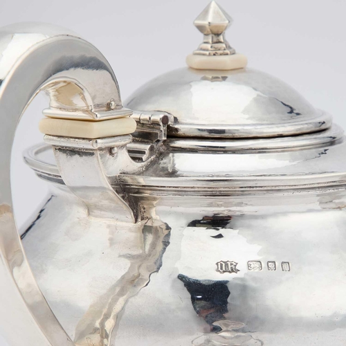 378 - OMAR RAMSDEN: AN ARTS AND CRAFTS SILVER THREE-PIECE TEA SERVICE by Omar Ramsden, London, 1923, 1924 ... 